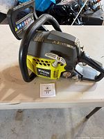 Full view of Ryobi chainsaw body showing missing bar and chain