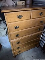 Front view of highboy showing all six drawers and hardware