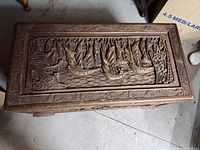Top view showing full carved sailing scene on lid