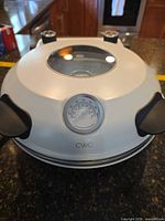 Front view of CWC WPM2 pizza oven showing thermometer and window