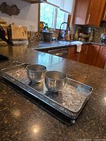 Tray and two cups on countertop showing overall lot