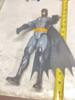 Full view of Batman figure beside ruler showing ~12 in height