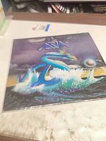 Front cover showing Asia dragon artwork in shrink