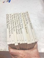 Spine view showing 12 numbered Beatrix Potter volumes