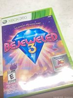 Front cover of Bejeweled 3 Xbox 360 case