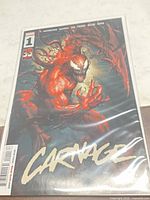 Front view of Carnage #1 comic in protective bag