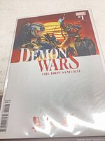 Front cover of comic in bag displaying title, artwork, and variant edition labeling