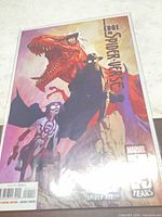 Front cover of bagged comic showing title, characters and Marvel 85 Years badge