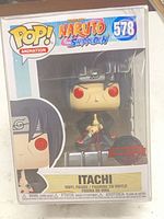 Front view of boxed Itachi Funko Pop! #578 showing exclusive sticker and figure