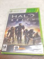 Front cover of sealed-looking Xbox 360 Halo: Reach game case