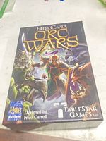 Front of HeroCard Orc Wars box showing title, artwork and publisher logos