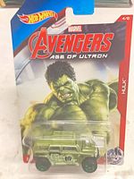 Front of sealed Hot Wheels blister card showing Hulk artwork and green SUV