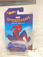 Front view of sealed Hot Wheels Spider-Man Homecoming blister pack with blue/red 1:64 car