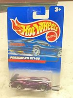 Front of sealed Hot Wheels Porsche 911 GT1-98 card showing purple car