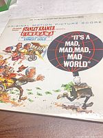 Front cover showing title, globe, caricature art, United Artists logo
