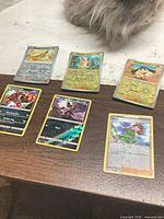 All six holographic Pokémon cards laid out