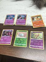 All six Pokémon cards laid out showing fronts