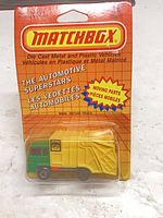 Front of sealed Matchbox MB59 Refuse Truck on original blister card showing vehicle color and packaging condition