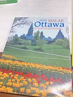 Front cover showing title, author, Parliament buildings and tulips