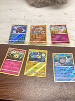 All six Pokémon holographic cards laid out
