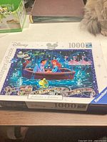 Front of puzzle box showing artwork and 1000-piece count