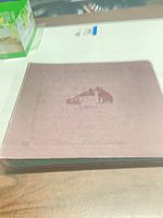 Front view of closed maroon LP binder
