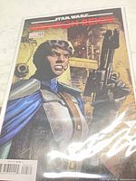 Front view of bagged comic showing full variant cover art