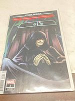 Front of bagged comic showing full cover art and Marvel logo with issue number