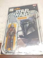 Front view of bagged comic showing variant blister-art cover