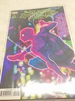Front cover showing Spider-Man neon cityscape artwork