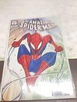 Front cover view showing full artwork and protective bag