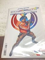Front view of bagged comic showing full Pride variant cover, price box and Marvel logo