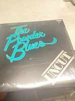 Front cover showing album art and shrink wrap