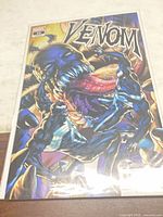 Front view of Venom #10 comic in protective sleeve