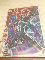 Front view of Venom #9 variant cover comic in protective sleeve