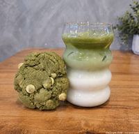 Iced layered matcha latte and green tea cookie as examples of cafe offerings