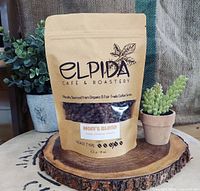 Elpida Café & Roastery branded coffee bean bag used as promotional image