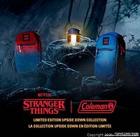 Front view of red-to-blue sling coolers on forest stump with Stranger Things and Coleman logos