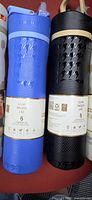Blue and black(?) packaged Contigo bottles showing texture and leak-proof lid label