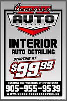 Promotional sign showing Georgina Auto Services branding and pricing example
