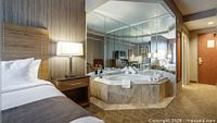 Sample Monte Carlo Inns Jacuzzi suite bedroom with tub illustrating accommodation type