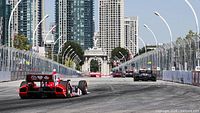 Indy race cars on track – represents the event