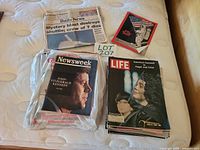 Lot overview showing newspaper, magazines and booklet