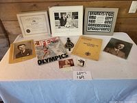 Overall lot showing all photographs, certificate, magazine, booklet and medallion