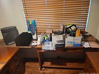 Overall view showing shredder, file sorter, boxed keyboard, assorted items on desk