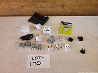 Group view of all adapters, cable and pouch on table