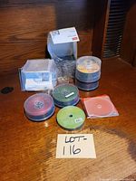 Group shot of all DVD+R spindles and jewel/slim cases on table