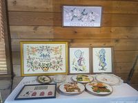 Entire lot arranged on table against wood wall