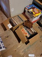Overview of two cardboard boxes filled with LP records