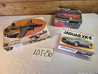 All three model kit boxes arranged on table